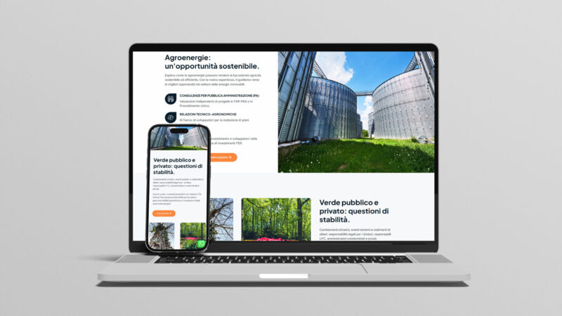 Laptop e smartphone con realizzazione sito web completo con homepage, immagini, articoli, sezioni.
